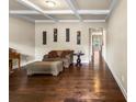 Inviting living room featuring hardwood floors, coffered ceilings, and comfortable seating at 1011 Potomac Rd, Indian Trail, NC 28079