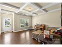 Inviting living room featuring hardwood floors, coffered ceilings, and natural light at 1011 Potomac Rd, Indian Trail, NC 28079