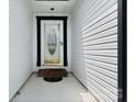 Entryway with decorative glass front door and covered porch, providing a welcoming entrance at 103 Pine Meadows Cir, Hickory, NC 28601