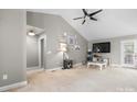 Bright living room with vaulted ceilings, ceiling fan, and cozy decor for relaxation at 103 Pine Meadows Cir, Hickory, NC 28601
