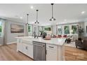Stylish kitchen with white cabinets, an island, modern appliances, and an open floor plan at 12028 Lavinia Ln, Charlotte, NC 28277