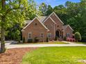 Handsome brick home with a circular drive, neat landscaping, and a welcoming front entrance at 130 Churchill Dr, Salisbury, NC 28144