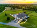 Expansive aerial view of estate featuring pool, outdoor living, long driveway, and surrounding pastures at 1351 Highway 324 None, Rock Hill, SC 29730