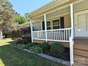 Close up of the porch with nice landscaping at 1495 Carson Rd, Cleveland, NC 27013