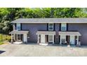 Exterior view of townhome-style condominiums with private patios and ample parking at 1512 Seigle Ave # 2, Charlotte, NC 28205