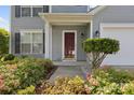 Inviting front porch with decorative plants, offering a charming entrance to the home at 1525 Moss Creek Dr, Harrisburg, NC 28075