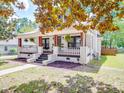 Charming two-story home features a welcoming front porch and a view of the side yard and front yard at 232 W Wilson Ave, Mooresville, NC 28115