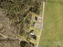 Aerial view showcasing property lines, home layout, and surrounding wooded area at 2853 Mathis Church Rd, Catawba, NC 28609