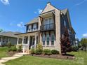 An eye-level exterior view reveals a charming two-story home with a welcoming front porch at 397 Luray Way, Rock Hill, SC 29730