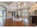Spacious foyer with hardwood floors, two-story ceiling, and glass-door office at 4117 Wallbrook Dr, Matthews, NC 28105