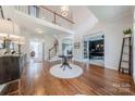 Bright foyer with hardwood floors, high ceilings, and staircase at 4117 Wallbrook Dr, Matthews, NC 28105