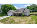 Lovely one-story home with a covered porch, attached two-car garage, and spacious front yard at 4949 Southview Dr, Hickory, NC 28602