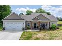 Attractive one-story home featuring a covered porch, two-car garage, and fresh landscaping at 4949 Southview Dr, Hickory, NC 28602