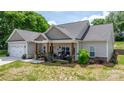 Charming covered front porch with rocking chairs and rustic decor at 4949 Southview Dr, Hickory, NC 28602