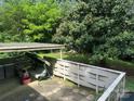 Cozy covered patio with a swing, perfect for relaxing and enjoying the outdoors at 5938 Sharon Rd, Charlotte, NC 28210