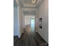 Inviting hallway featuring wood floors leading to an open, light-filled living space at 6642 Star Dr, Sherrills Ford, NC 28673
