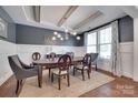 Stylish dining area featuring a modern chandelier, neutral walls, and hardwood floors at 724 Lagan Ct, Fort Mill, SC 29715