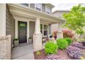 Inviting front porch with rocking chairs, stylish planters, and well-maintained landscaping at 724 Lagan Ct, Fort Mill, SC 29715