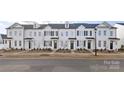 Attractive new construction townhomes with coordinating landscaping and sidewalk at 8118 Jacey Ln # 20, Huntersville, NC 28078