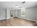Bright living room with wood floors and ample natural light at 842 Murphy St, Kannapolis, NC 28081