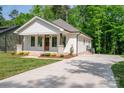 Lovely single-story home featuring a well-manicured lawn, inviting front porch, and a convenient concrete driveway at 1012 W Carroll St, Cherryville, NC 28021