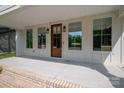 Inviting front porch showcasing a stylish wood door, sidelight windows, and a spacious seating area at 1012 W Carroll St, Cherryville, NC 28021