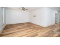 Bright living room boasting hardwood floors, neutral paint, ceiling fan, and ample natural light at 1012 W Carroll St, Cherryville, NC 28021