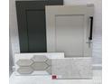 A curated selection of interior design materials that includes cabinet and tile samples at 149 Glenn Dr, Mooresville, NC 28115