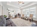 Bright, open-concept living space with hardwood floors seamlessly flows into a modern kitchen at 16112 Lakeside Loop Ln, Cornelius, NC 28031
