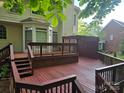 Spacious wooden back deck with a privacy screen, perfect for outdoor relaxation and entertaining at 3104 Highgate Dr, Fort Mill, SC 29715