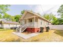 Cozy one-story home features a porch with stairs and easy access to the back at 420 Baker Street Ext, Rock Hill, SC 29730