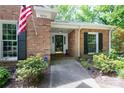Inviting front entrance featuring brick facade, manicured landscaping, and prominent house number at 4234 Woodglen Ln, Charlotte, NC 28226