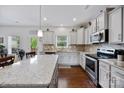 Modern kitchen with stainless steel appliances, granite countertops, and a center island with seating at 5384 Gatsby Cir, Rock Hill, SC 29732