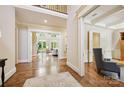 Elegant foyer featuring hardwood floors, detailed trim and an open floor plan at 5701 Challisford Ln, Charlotte, NC 28226