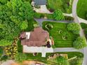 Aerial view of a well-manicured property showing a home, mature trees, and sprawling lawn at 6164 Dwayne Starnes Dr, Hickory, NC 28602