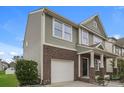 A two-story home with a combination of brick and vinyl siding and an attached garage at 838 Von Buren Blvd, Rock Hill, SC 29730
