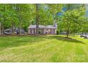 Beautiful home with a large green lawn and lush trees, offering a serene and inviting curb appeal at 10200 Cairnsmore Pl # 9, Mint Hill, NC 28227