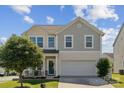 Charming two-story home featuring a covered front porch and an attached two-car garage at 1180 Bannockburn Ave, Rock Hill, SC 29732