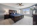 Spacious main bedroom features a ceiling fan, large windows, neutral walls and an ensuite bathroom at 1180 Bannockburn Ave, Rock Hill, SC 29732