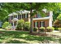 Well-maintained brick house featuring a lush green lawn and established landscaping at 1261 Hawthorne Dr, Indian Trail, NC 28079