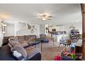 Spacious living room with a comfortable sectional sofa, ceiling fan, and open layout to the kitchen at 1270 Winding Creek Rd, Salisbury, NC 28146