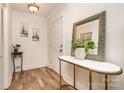 Bright entryway featuring wood floors and stylish accents at 145 Driftwood Dr, Mooresville, NC 28117