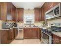 Kitchen boasts stainless steel appliances and updated counters at 145 Driftwood Dr, Mooresville, NC 28117