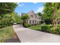 Charming brick house featuring a long driveway and lush landscaping at 1929 Faison Ave, Fort Mill, SC 29708