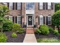 Inviting front entrance with a classic door, wreath, and manicured landscaping at 1929 Faison Ave, Fort Mill, SC 29708