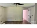 Renovated living room featuring new wood floors and a freshly painted door and trim at 2131 Barnett St, Lancaster, SC 29720
