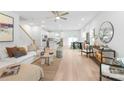 Open-concept living room with natural light, modern furnishings, and wood floors, creating a comfortable and inviting atmosphere at 2813 New Pineola Rd, Charlotte, NC 28208