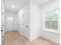 Bright entryway featuring hardwood floors, neutral paint, and ample natural light from a window at 2815 New Pineola Rd, Charlotte, NC 28208