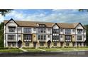 Attractive three-story townhome showing the black framed windows, doors, and tan brick facade at 3132 Stelfox St, Charlotte, NC 28262