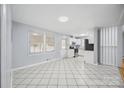 Bright eat-in kitchen features white cabinets, modern appliances, and tile flooring at 3828 Delgany Dr, Charlotte, NC 28215